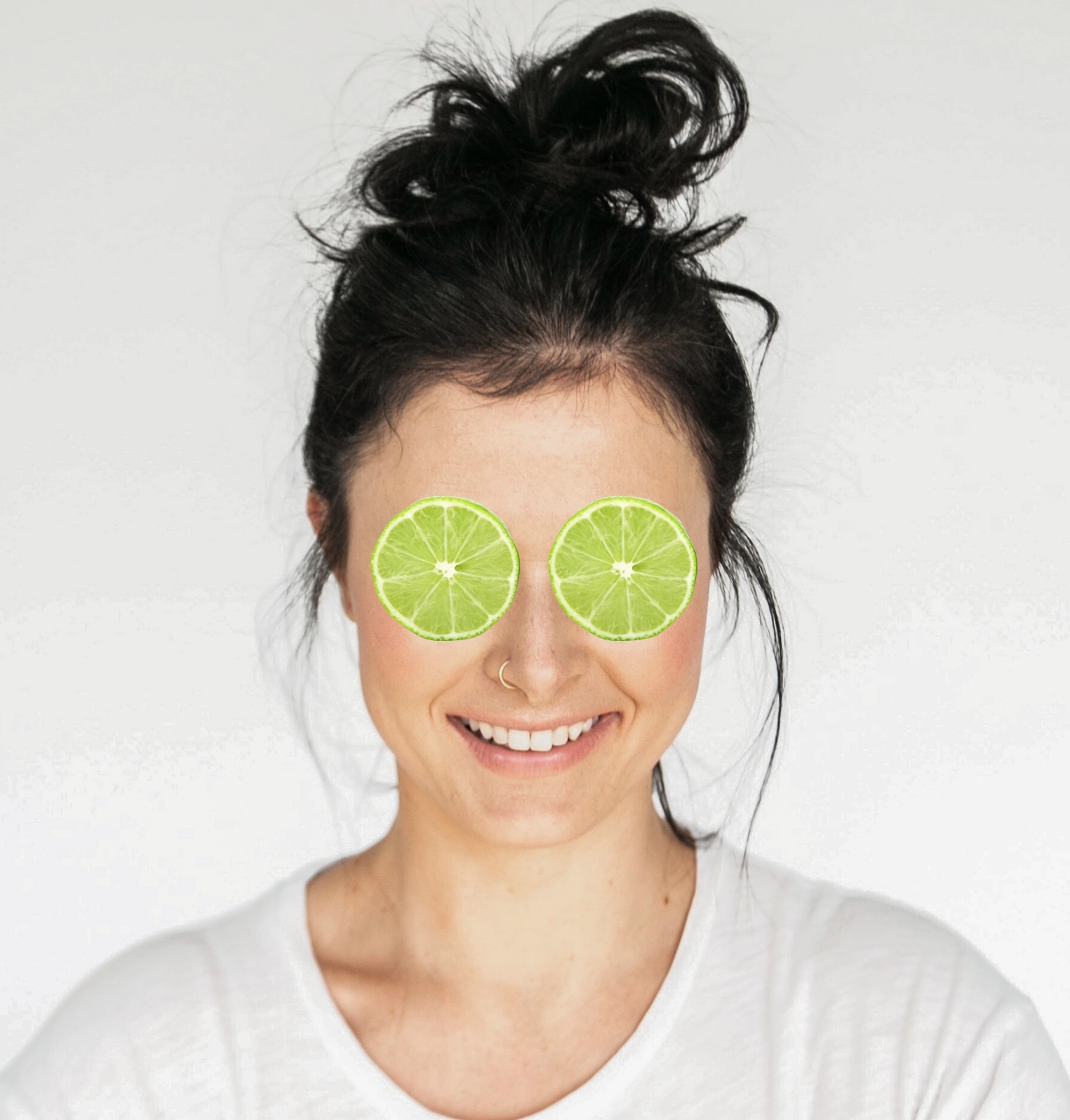 a person with slices of lime on her eyes